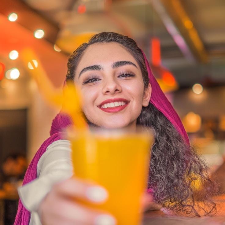 Alexandra Patel, Lead Design Curator at Ever Green River Portal, reviewing corporate floral arrangements